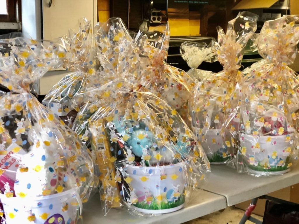 Amy LaBrache and her daughter Sarah, 8, assembled Easter baskets for 20 families in need in the town with help from fellow residents and the Jaycees
